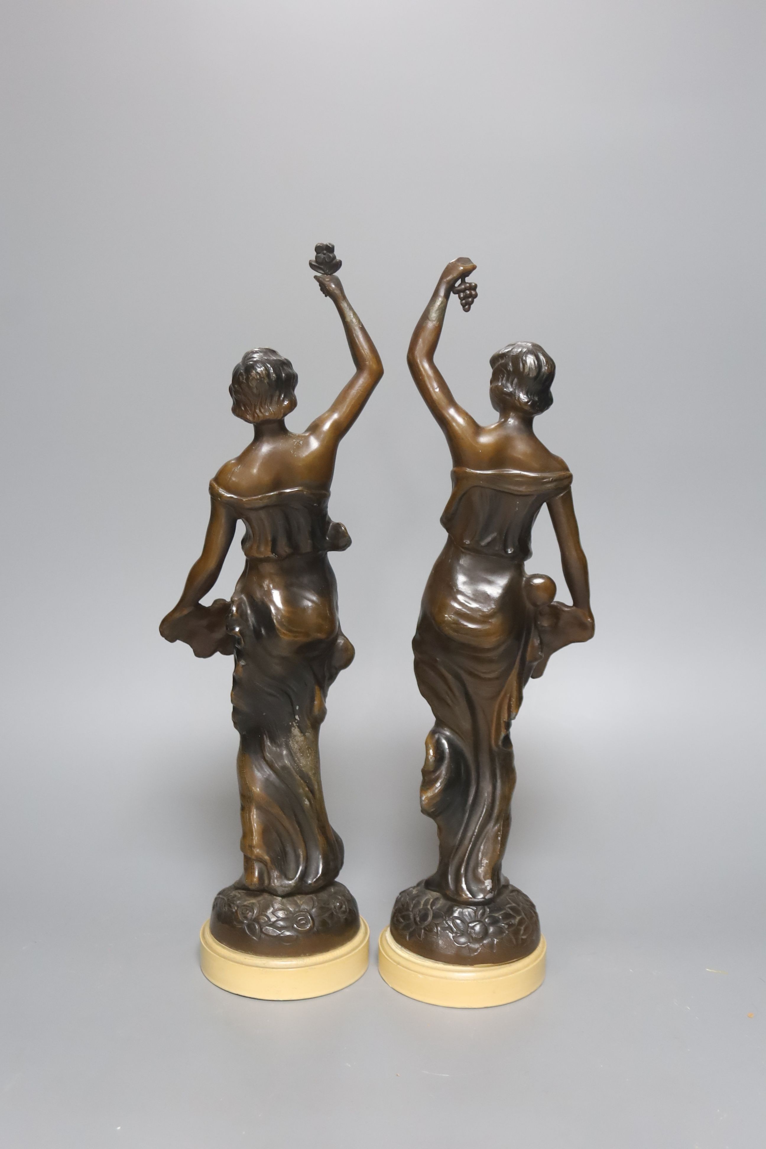 A pair of patinated spelter figures 37cm